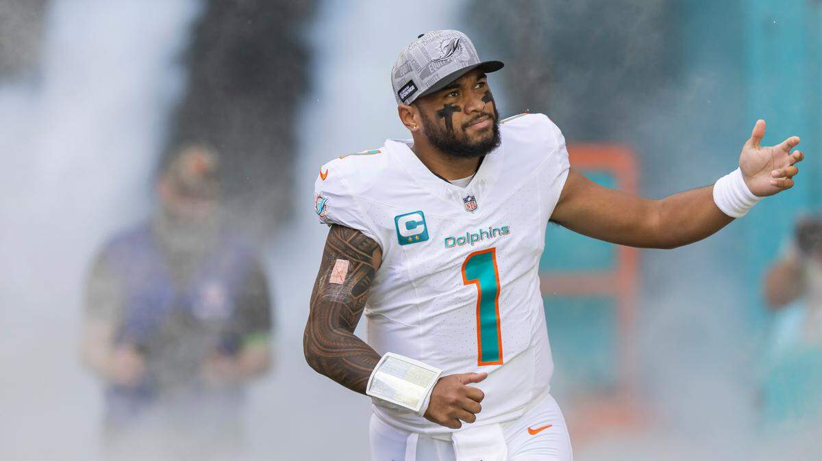 Miami Dolphins quarterback Tua Tagovailoa (1) reacts while making his way onto the field before the start of an NFL game against the New York Jets at Hard Rock Stadium on Sunday, Dec. 17, 2023, in Miami Gardens, Fla.