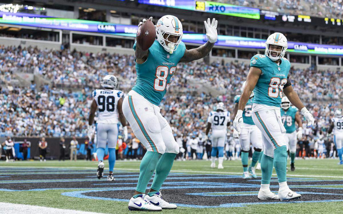 Miami Dolphins tight end Darren Waller (83) celebrates after scoring a touchdown against the Carolina Panthers in the first half of their NFL game at the Bank of America Stadium on Sunday, Oct. 5, 2025, in Charlotte, N.C.