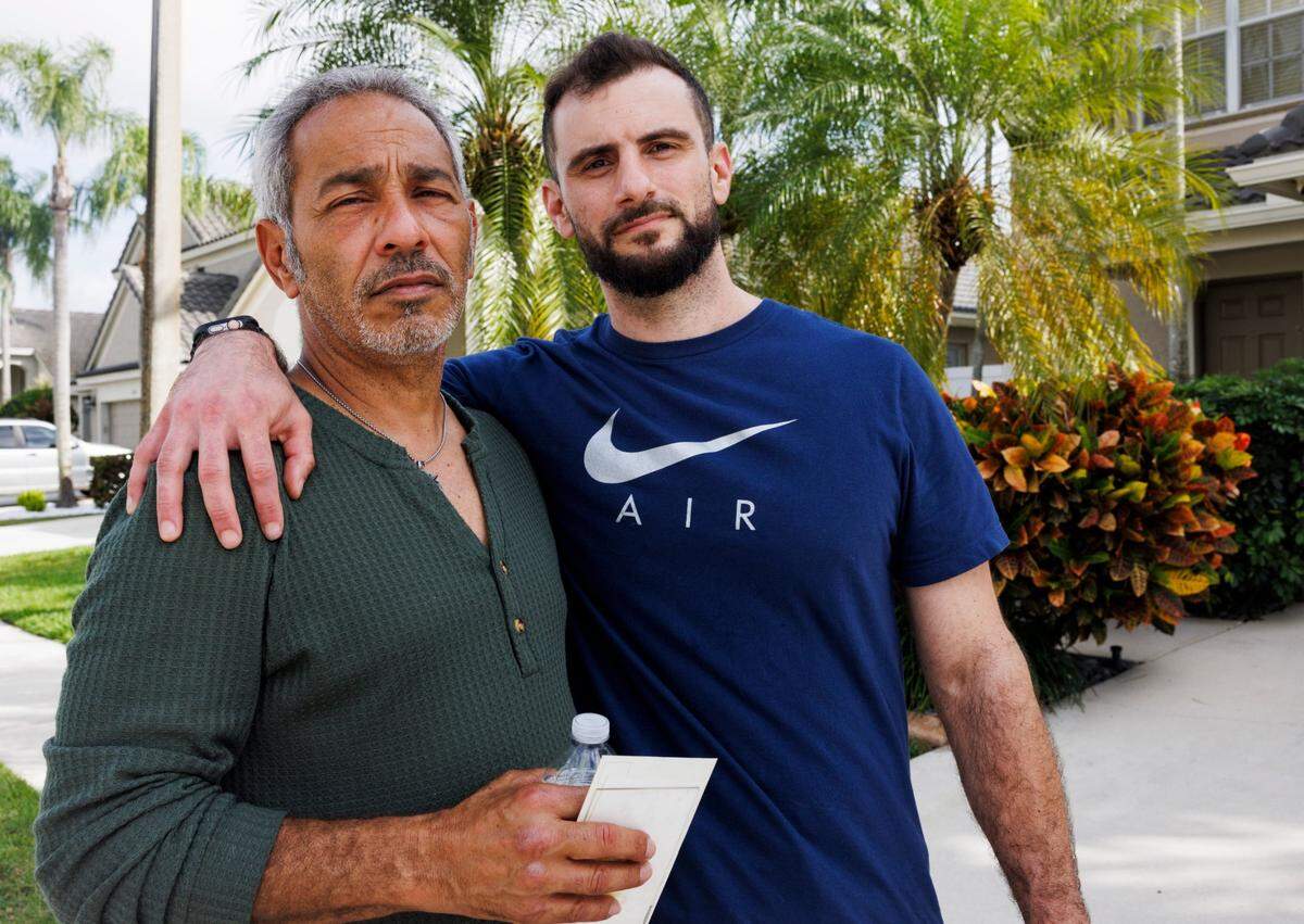 George David Jr., uncle of Andrew Ferrin who was killed over the weekend, left, stands with Alex, Andrew’s best friend, outside the home on Tuesday, Feb. 18, 2025, in Tamarac, Fla.