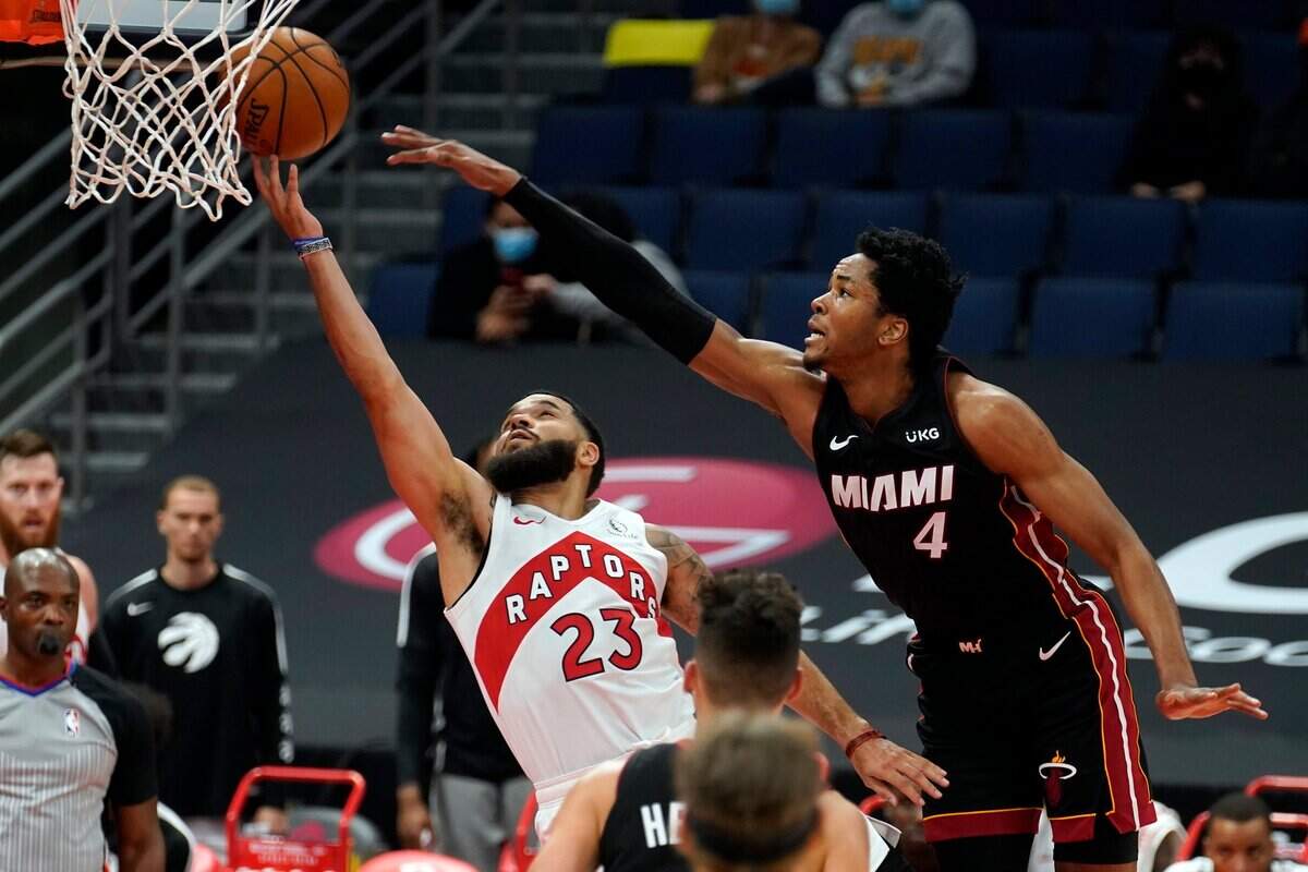 Toronto Raptors guard Fred VanVleet (23) gets fouled by Miami Heat forward KZ Okpala (4) during the first half of an NBA preseason basketball game Friday, Dec. 18, 2020, in Tampa.
