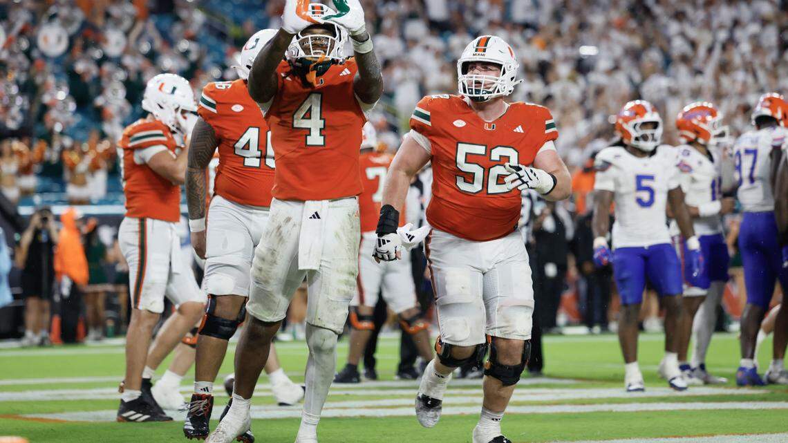 Miami Hurricanes running back Mark Fletcher Jr. (4) flashes the U after scoring in the second half of their NCAA football game against the Florida Gators at Hard Rock Stadium in Miami Gardens, Florida, on Saturday, September 20, 2025.