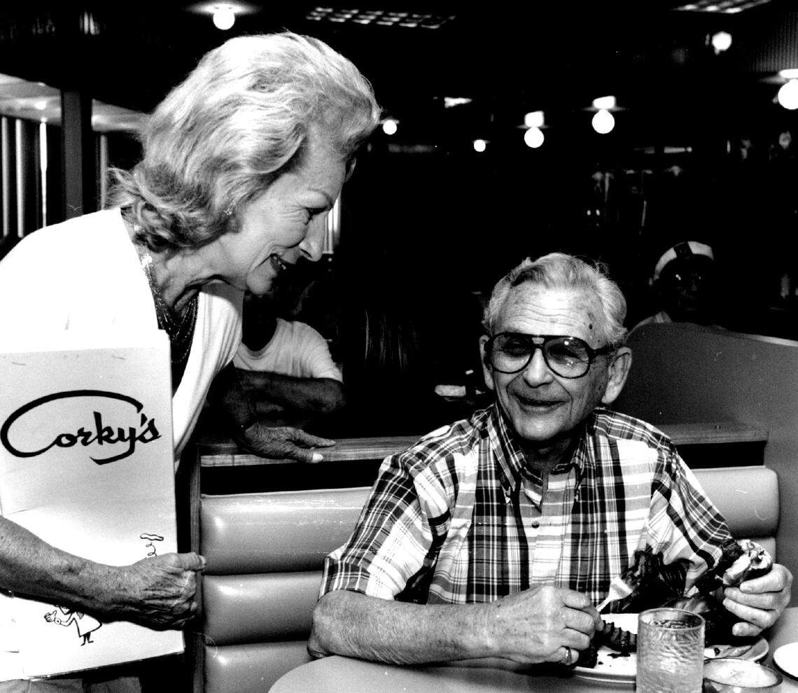 In 1993, server Maja Huyette stops by Herb Weinberg’s table to see how much he is enjoying his “Zaftig Sandwich” and potato pancakes.