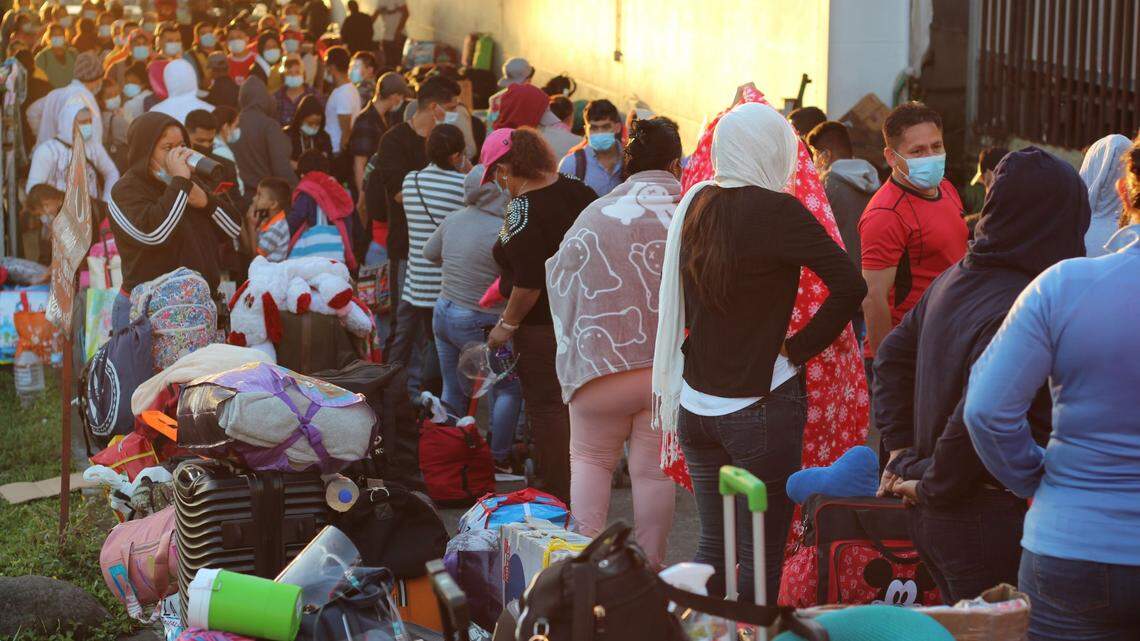 Nicaraguan migrants prepare to cross into Costa Rican territory on their way to their country, in the border town of Paso Canoas, Panama, 11 February 2021. A total of 224 Nicaraguan migrants left today for their country. Of them, 121 had been stranded for more than seven days at the Paso Canoas border, between Panama and Costa Rica, waiting for the Nicaraguan health authorities to authorize their entry.