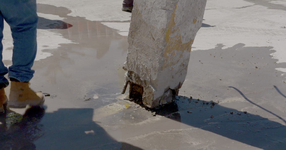 Severe corrosion shown in the base of a column in the basement of Champlain Towers South is visible in a video published by the National Institute of Standards and Technology on Aug. 25, 2021. This is a screen capture from that video.