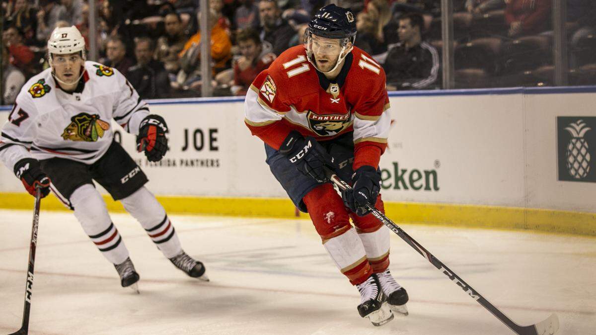 Florida Panthers left wing Jonathan Huberdeau (11) skates with the puck in the first period as the Florida Panthers host the Chicago Blackhawks at the BB&T Center in Sunrise on Saturday, February 29, 2020.