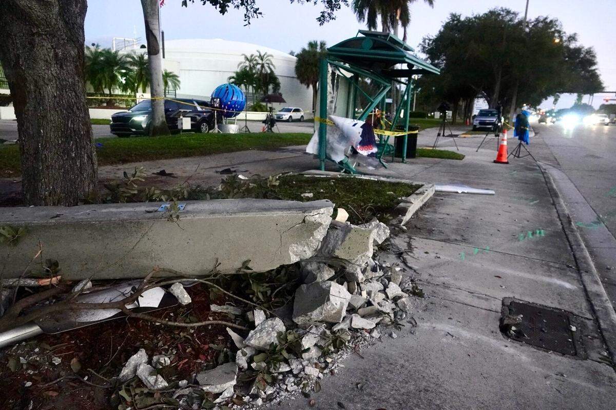 The site of a fatal car crash on the 1600 block of North Federal Highway in Pompano Beach, Florida, on Tuesday, Dec. 30, 2025. Three teenagers, ages 15, 16, and 18, died after their car collided with another vehicle and struck a concrete light pole and bus stop on Monday evening.