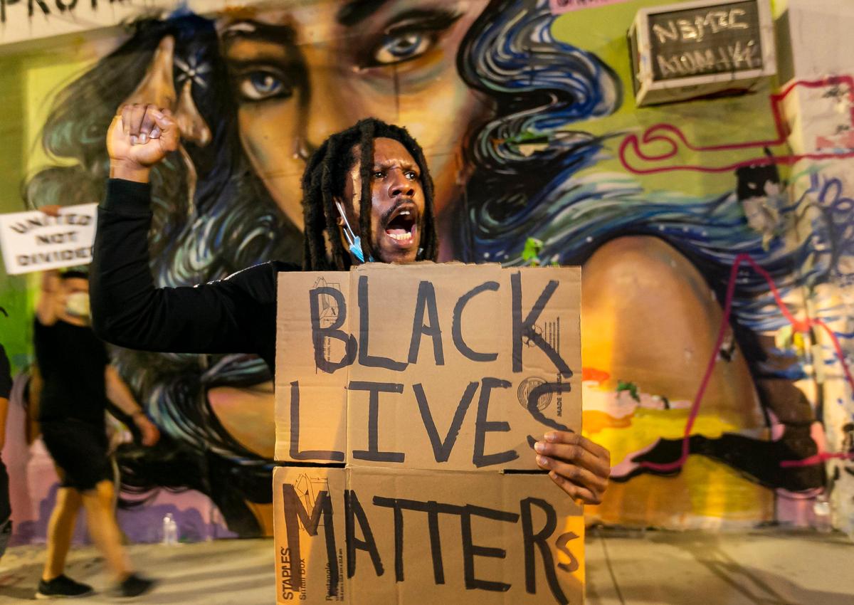 Activists make their way through MiamiÕs Wynwood neighborhood during a Justice for George Floyd rally on Friday, June 5, 2020.