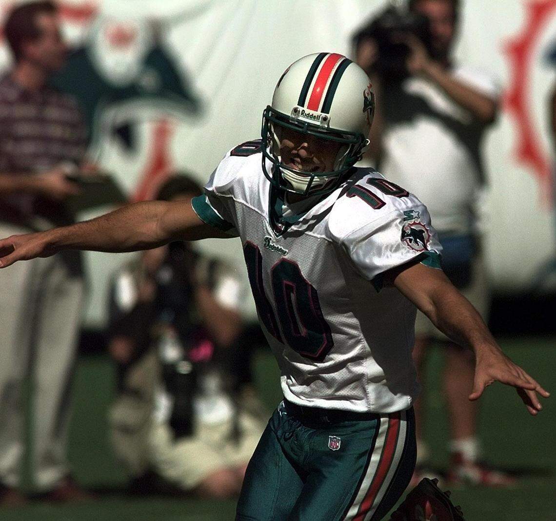 FOR SPORTS 9/7/97 PHOTO BY JOE RIMKUS JR MHS Tennessee Oilers vs Miami Dolphins at Pro Player Stadium in Miami.Kicker Olindo Mare flys after kicking winning kick in OT>