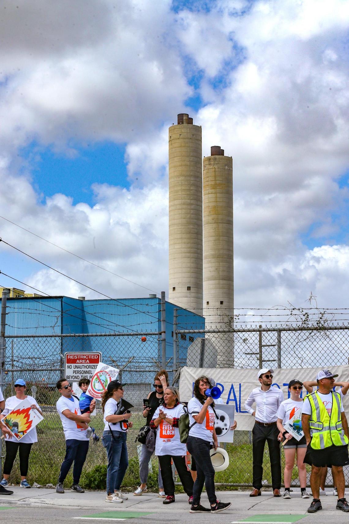 Serena Perez chants on a megaphone speaker as Doral residents protest against a new garbage incinerator the county is considering in Doral on Saturday, April 23, 2022. The current incinerator is up for renewal.
