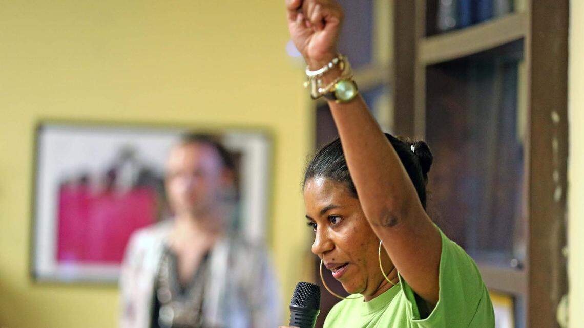 Domestic violence survivor Sherry Hunt raises her arm in Miami to celebrate a new Florida law, which went into effect July 1, 2019, that provides unemployment benefits to domestic abuse survivors who’ve been forced to quit their job and/or relocate to avoid an abusive situation. 