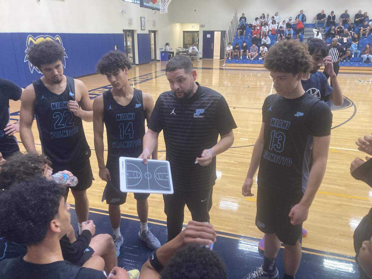Palmetto head coach Alex Ordoqui talks it up with his players during a timeout of Tuesday’s third-place game against Belen Jesuit in the Junior Orange Bowl Classic.