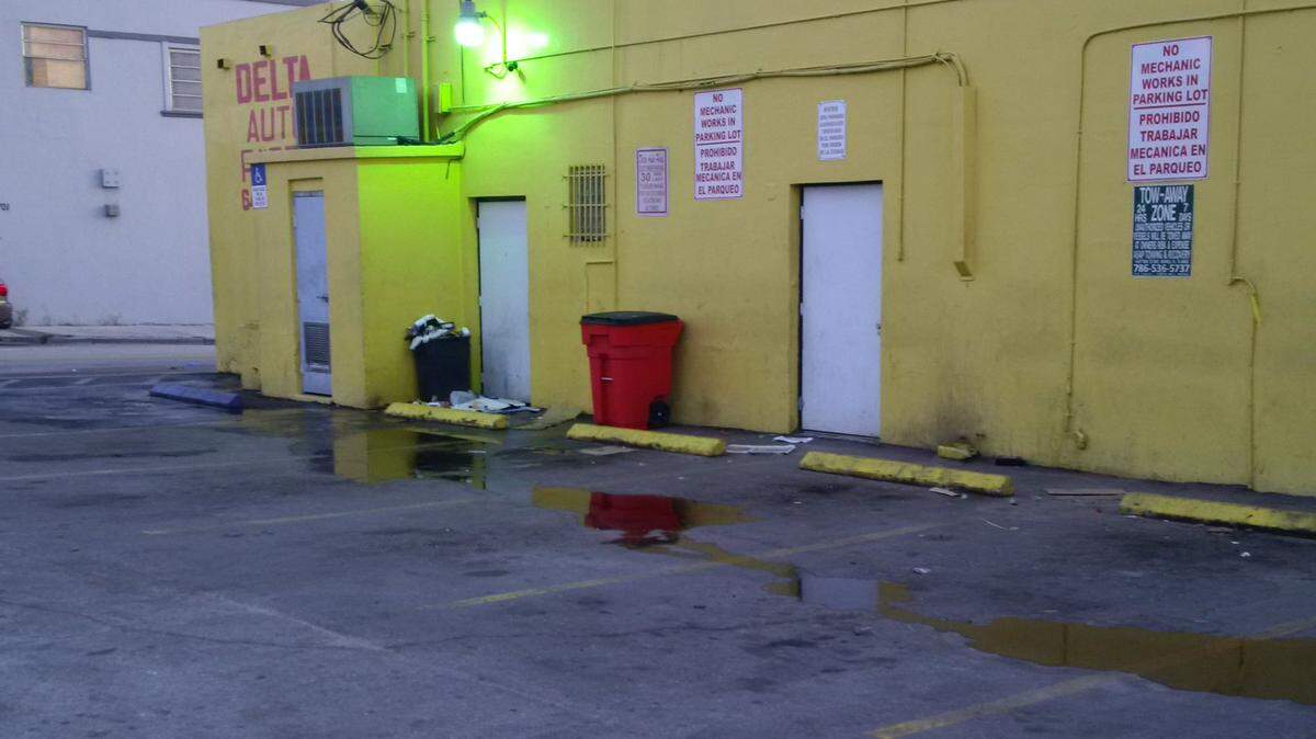 The rear of Delta Auto Parts in Little Havana hours after Miami police found a man shot there.