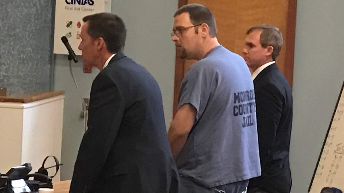 Derek David stands between his attorneys, Donald Barrett and Dustin Hunter, at the Plantation Key courthouse on Monday, May 7.
