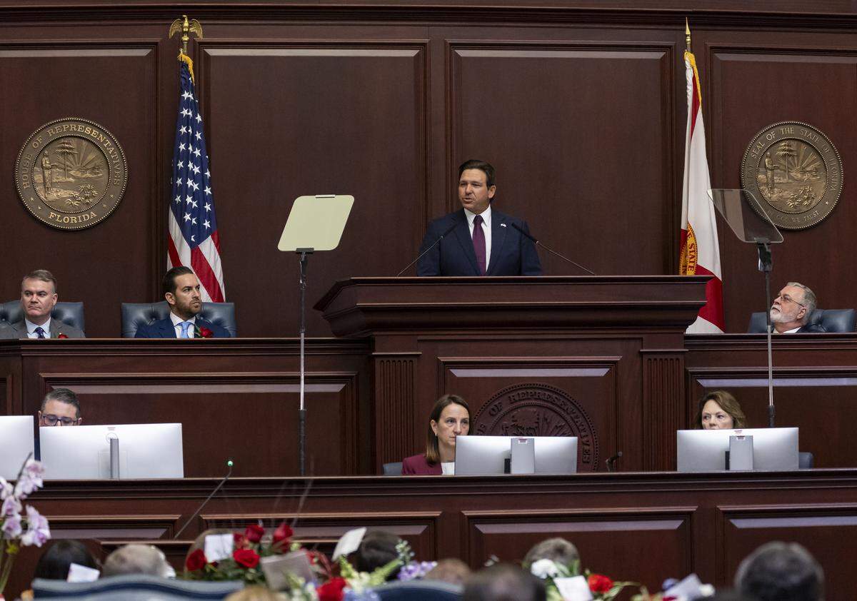 Florida Governor Ron DeSantis delivers his State of the State address as Florida House Speaker Daniel Perez, R-Miami, and Florida Senate President Ben Albritton, R-Wauchula, listen during the first day of the legislative session at the Florida State Capitol on Tuesday, Jan. 13, 2026, in Tallahassee, Fla.
