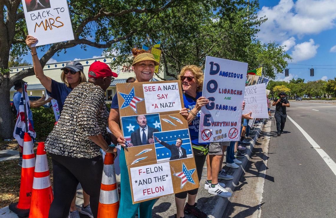 Lynn Millard was among a group of “outraged” people that protested in front of the Fort Lauderdale Tesla Showroom against the recent actions of President Donald Trump administration, in which Elon Musk now plays a key role — including mass layoffs, the removal of federal programs and funding for medical research, on Saturday March 15, 2025.