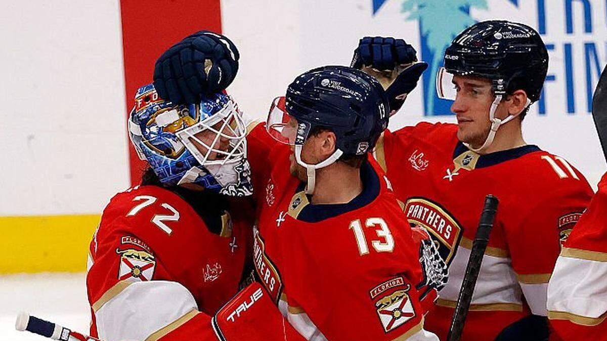 SUNRISE, FLORIDA - MARCH 12: Goaltender Sergei Bobrovsky #72 and Sam Reinhart #13 of the Florida Panthers embrace after their overtime win against the Columbus Blue Jackets at the Amerant Bank Arena on March12, 2026 in Sunrise, Florida. (Photo by Eliot J. Schechter/NHLI via Getty Images)