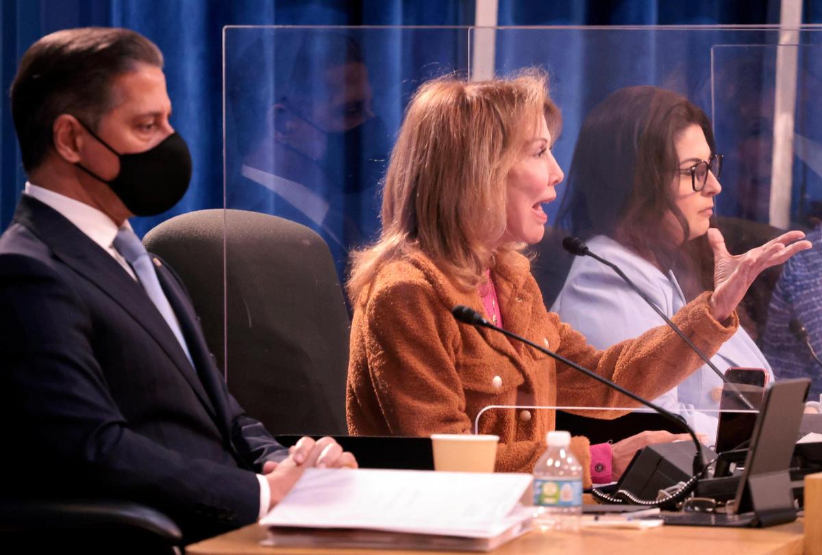 Superintendent Alberto Carvalho, left, listens as Miami Dade School Board member Dr. Marta Pérez  addresses the possible reason for Carvalho’s departure during a special meeting regarding terms of his replacement on Wednesday, Jan. 5, 2022, in Miami.