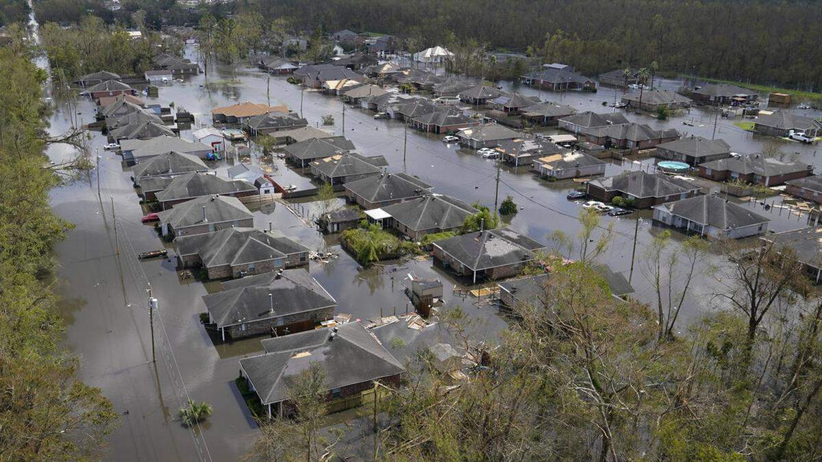 Homes are flooded in the aftermath of Hurricane Ida in LaPlace, La., Tuesday, Aug. 31, 2021. Louisiana State University researchers’ new hurricane model can help governments better plan for disasters and alleviate the impact of storms like Ida. (AP Photo/Gerald Herbert)
