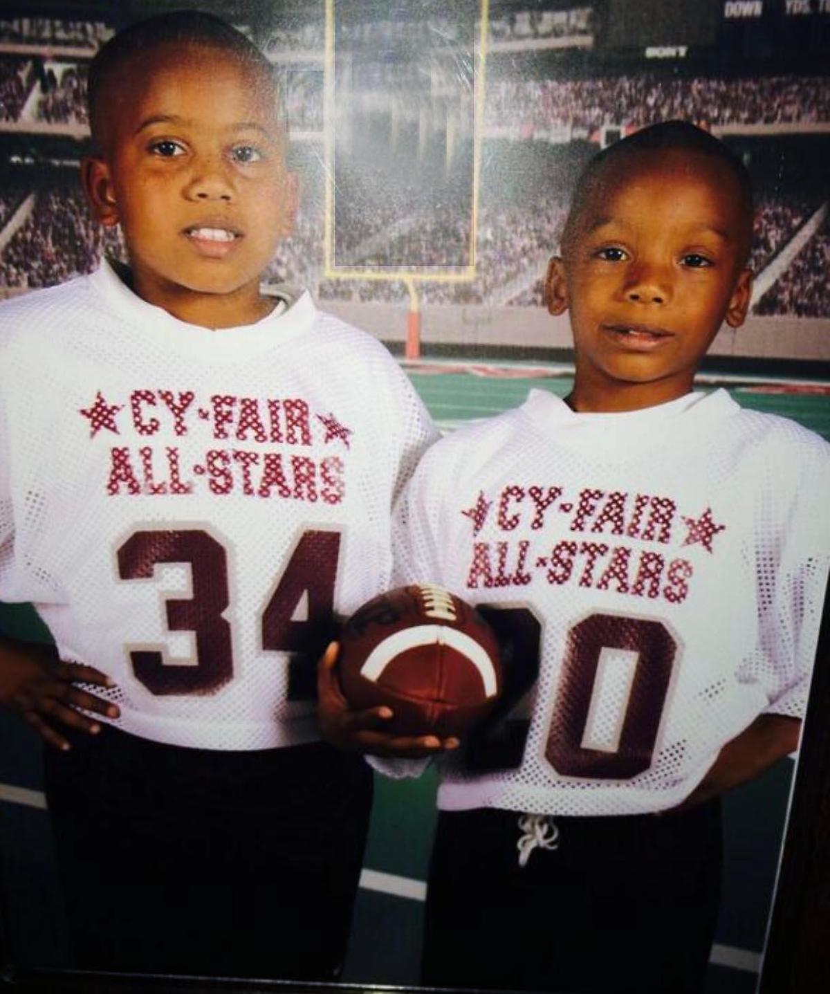 Keshon King (left) stands with younger brother D'Eriq, now the Miami Hurricanes quarterback, when both played youth football. Keshon said he was about 7 in the photo, and D'Eriq, 5.  Photo courtesy of the King family.
