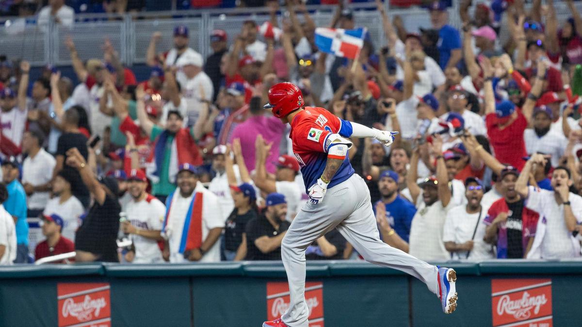 Dominican Republic third baseman Manny Machado (13) celebrates after hitting a home run against Nicaragua during the seventh inning of a Pool D game at the World Baseball Classic at loanDepot Park on Monday, March 13, 2023, in Miami, Fla.