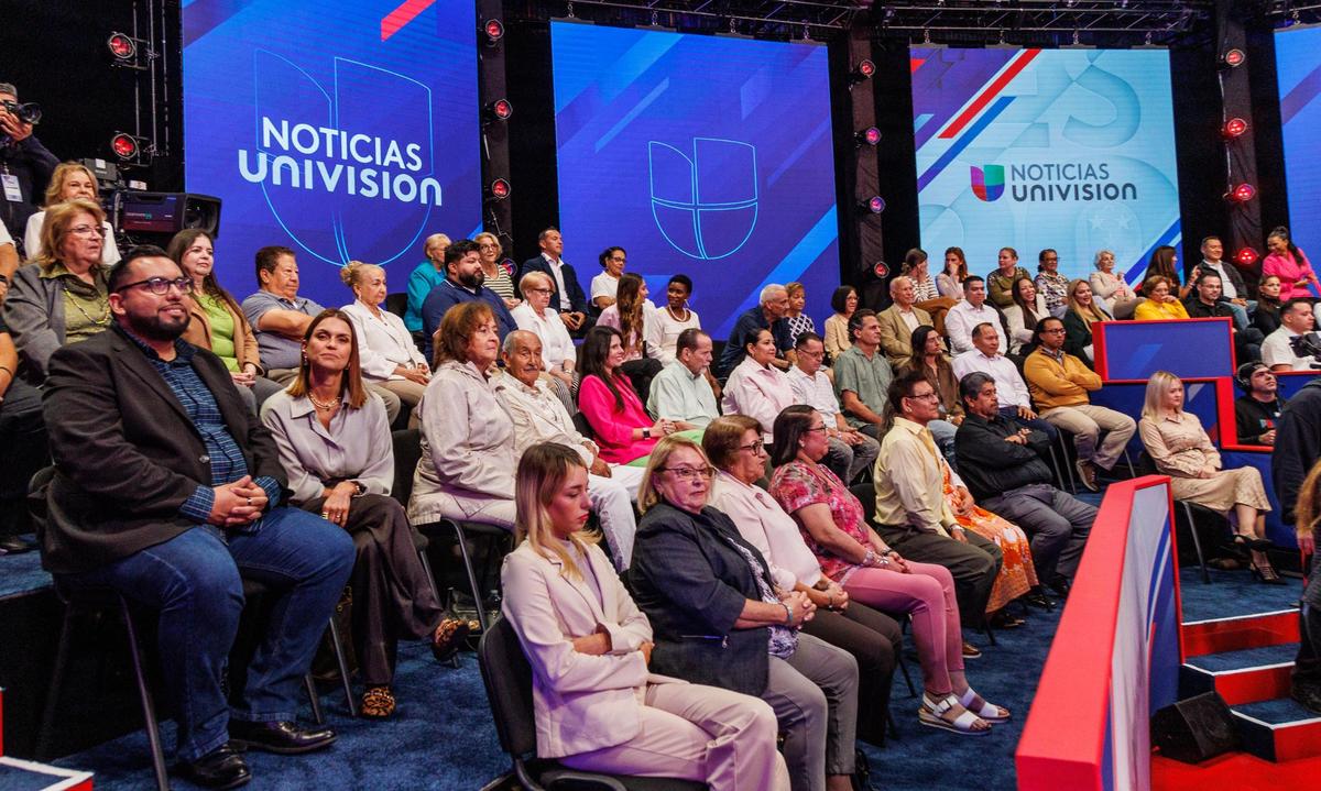 Attendees listen as Republican nominee former President Donald Trump answers questions, during a Noticias Univision’s Town Hall, “Los Latinos Preguntan” at Univion studios in Doral, on Wednesday, October 16, 2024.