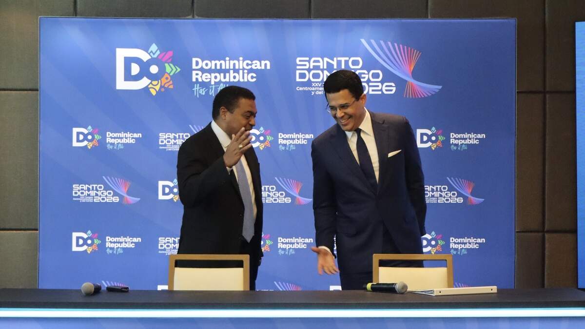 José Monegro, left, president of the Santo Domingo 2026 Organizing Committee, and Dominican Republic Tourism Minister David Collado share a laugh during a news conference promoting the 2026 Central American and Caribbean Games in Miami on Thursday, July 9, 2026.