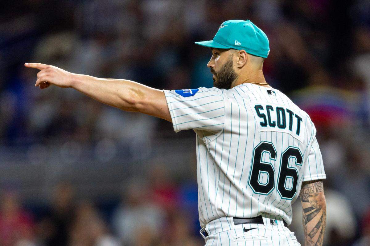 Miami Marlins pitcher Tanner Scott (66) reacts to defeating the Atlanta Braves 9-6 after the ninth inning of an MLB game at loanDepot park in the Little Havana neighborhood of Miami, Florida, on Friday, September 15, 2023