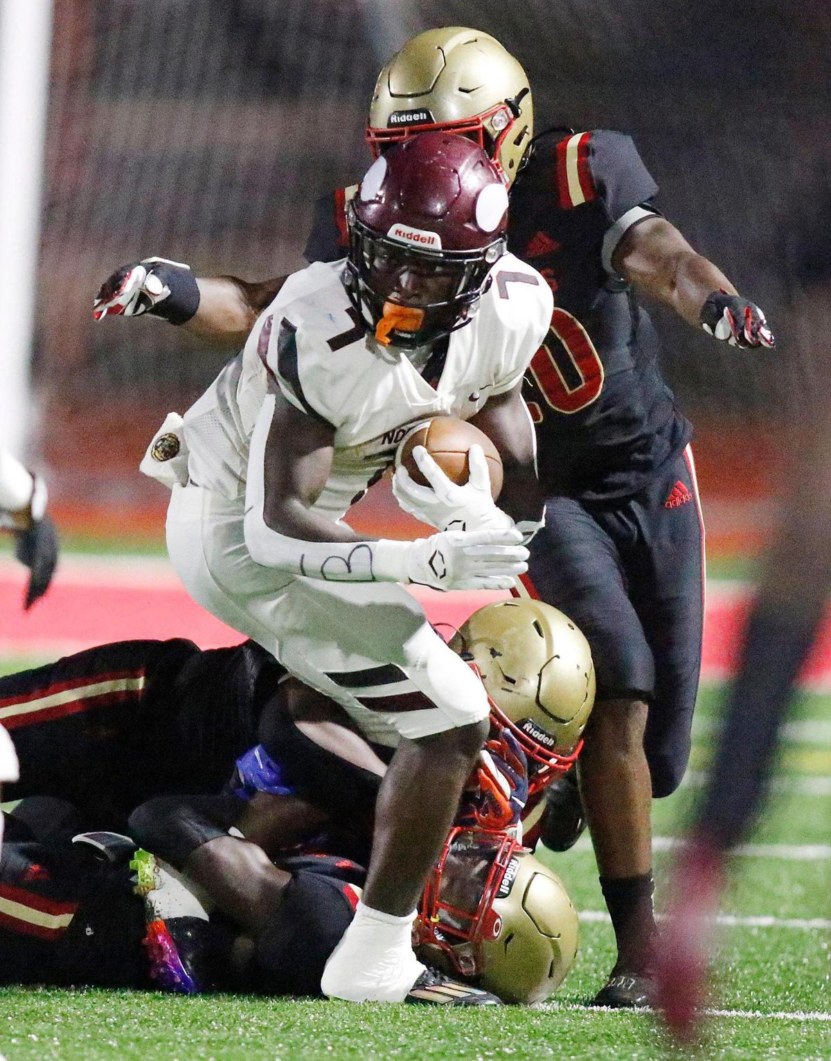 Monsignor Pace Spartans defenders tackle Norland Vikings running back Javin Simpkins (7) during football game on Friday, September 16, 2022 at Monsignor Pace HS in Miami. Andrew Uloza / for Miami Herald