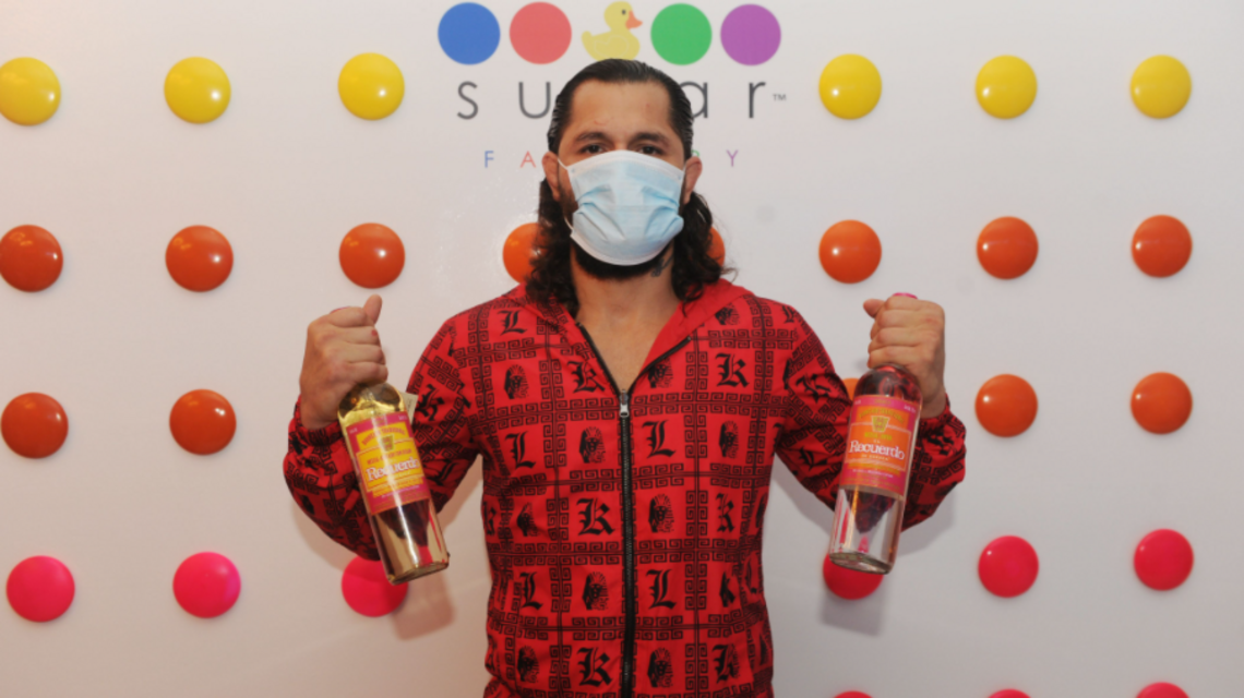 This MMA fighter just celebrated the launch of a new cocktail in Miami — mask included