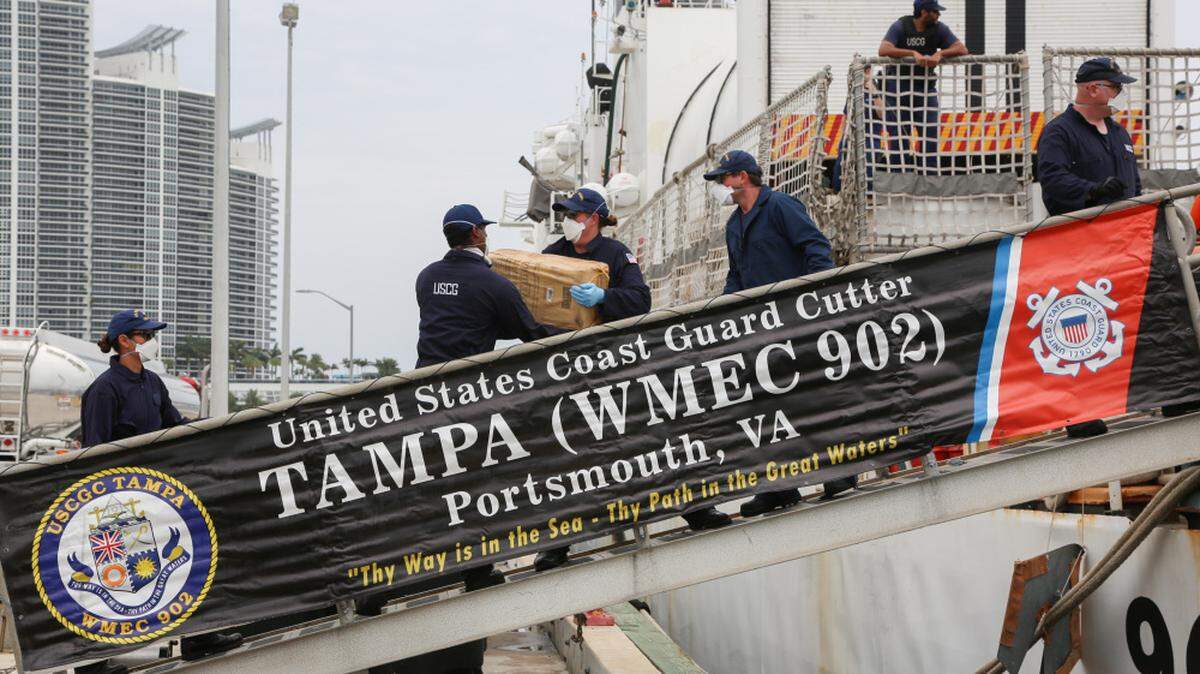 Coast Guard Cutter Tampa crew offloads about 5,500 pounds of cocaine, worth an estimated $94.6 million, at Base Miami Beach, April 20, 2021.