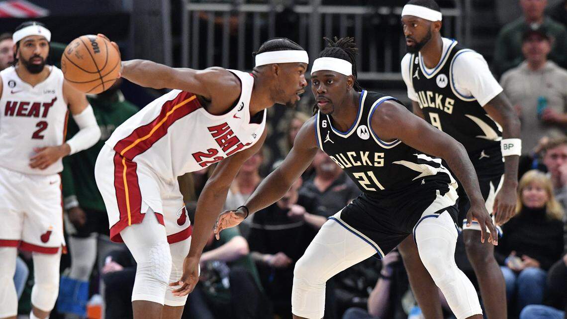 Miami Heat forward Jimmy Butler (22) against Milwaukee Bucks forward Khris Middleton (22) in the second half during game one of the 2023 NBA Playoffs at Fiserv Forum.