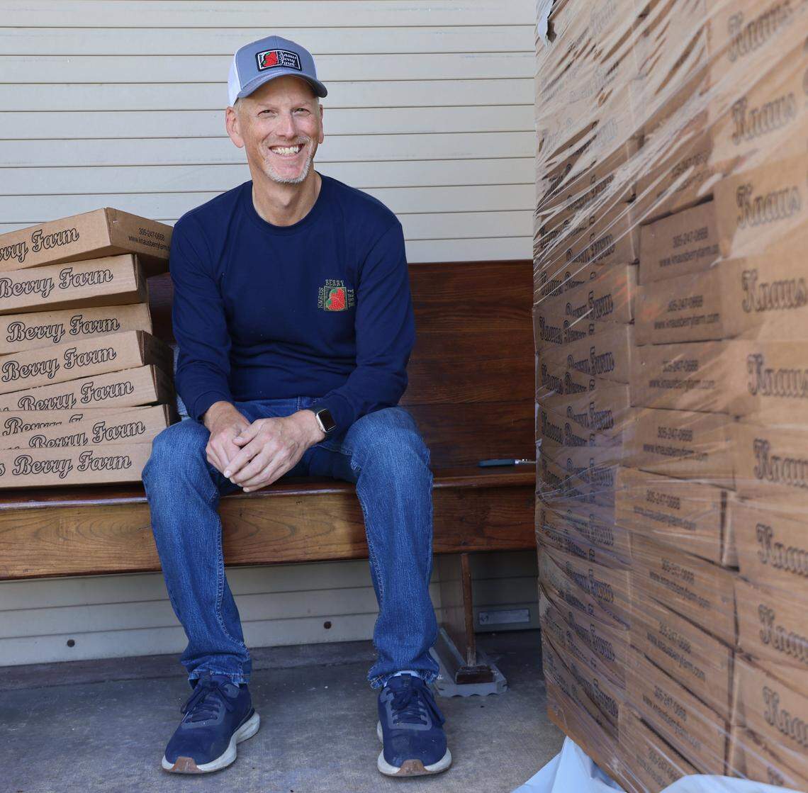Knaus Berry Farm's general manager Joel White with boxes of cinnamon rolls, which are also available for purchase on Goldbelly. 