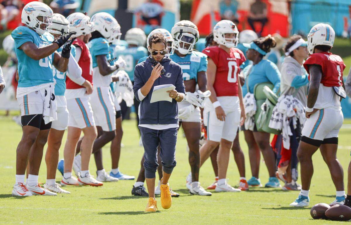 Miami Dolphins head coach Mike McDaniel walks on the field during a joint practice with the Jacksonville Jaguars.