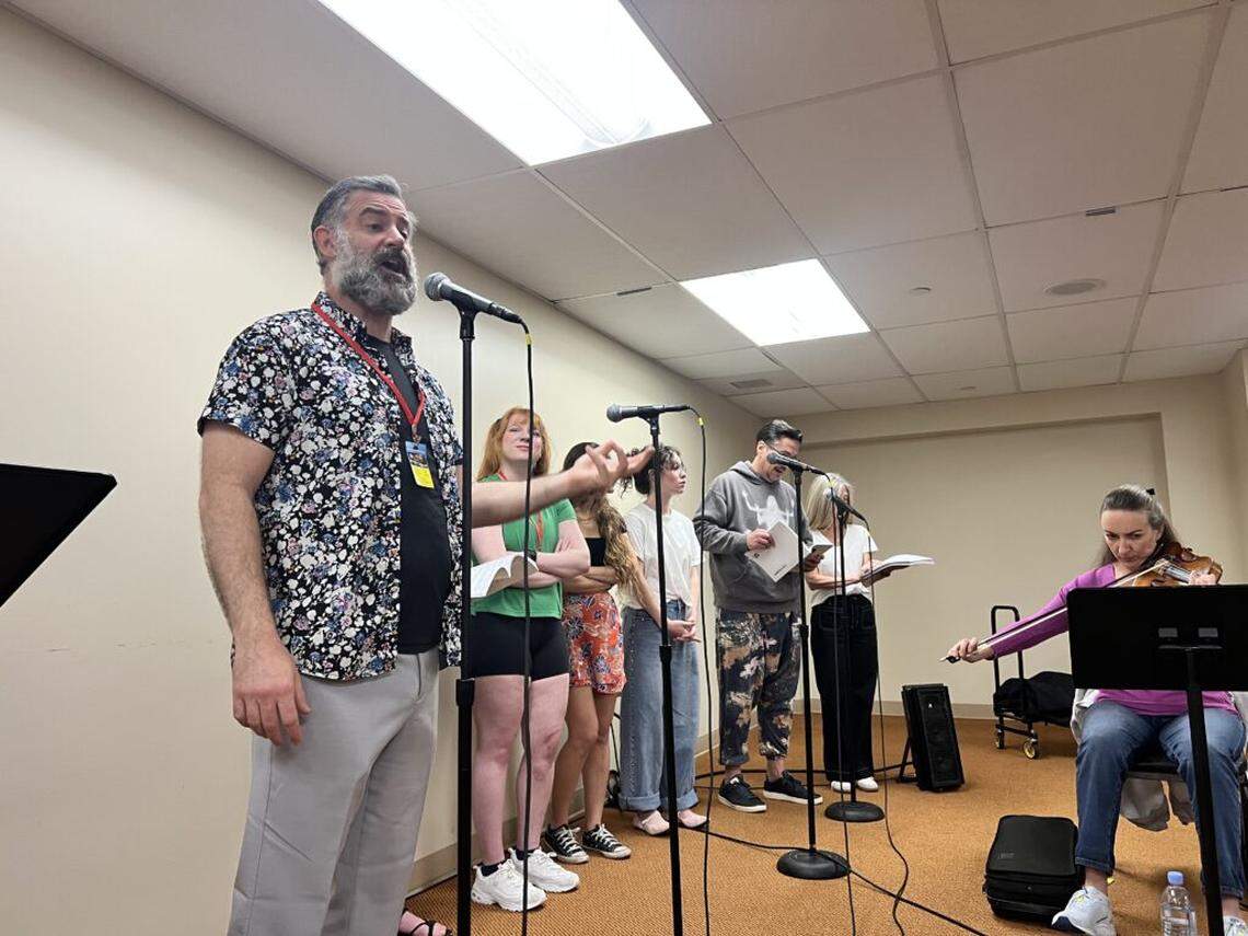 Ben Sandomir, who plays the lead role of Teyve, rehearses a musical number with the cast and band for Zoetic Stage’s production of “Fiddler on the Roof.“