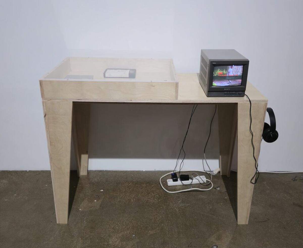 A mini-TV plays video from “Sak Pasé, U.S.A.?,” an unproduced Haitian Creole version of “Qué Pasa.” The only extant footage from the project, showing the title sequence, was recovered and digitized by Barron Sherer, a Miami-based media artist and archivist.