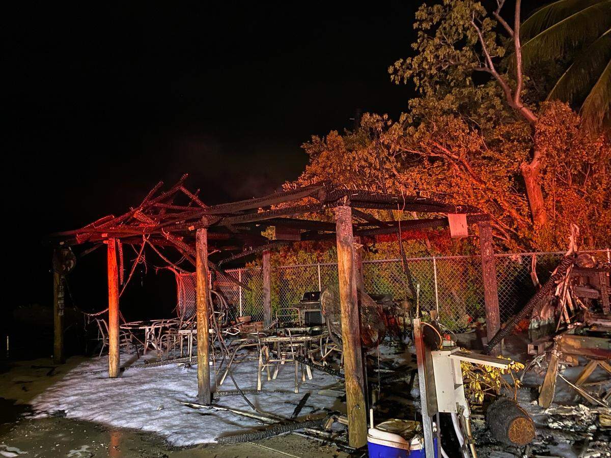 A fire that destroyed a trailer in Key Largo Tuesday, July 18, 2023, also destroyed a nearby tiki hut.