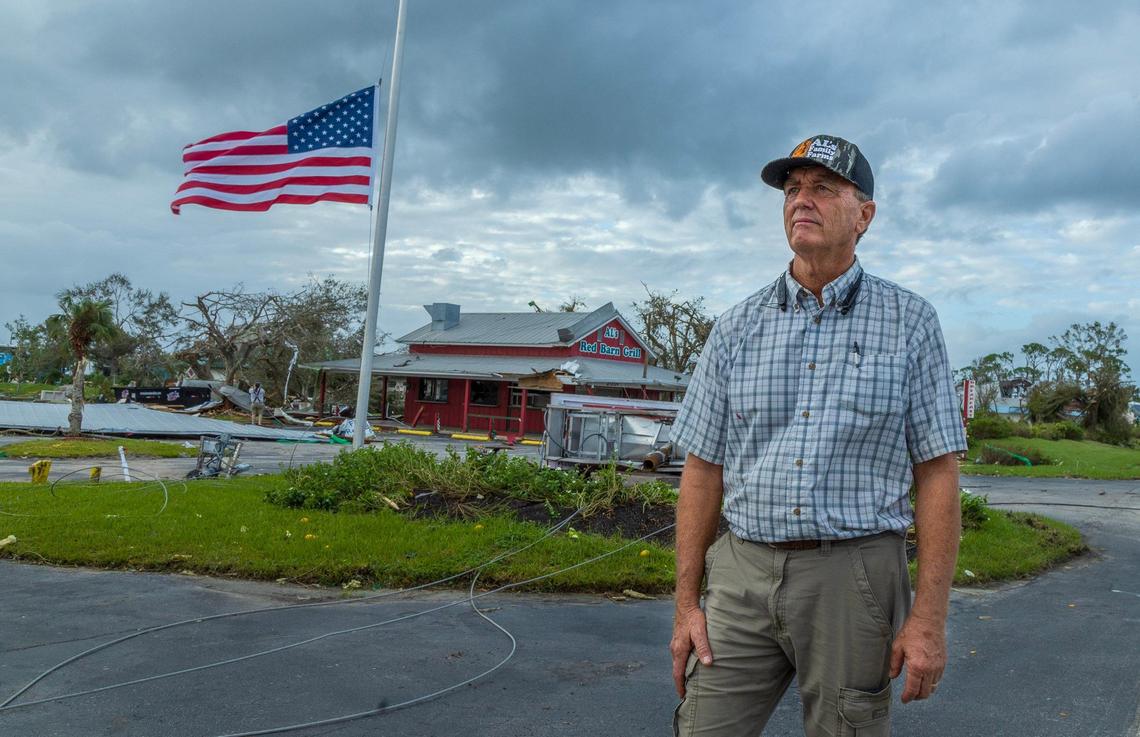 Owner Jeff Schorner stands in front of his business, Al’s Family Farms, an American flag flying at half staff, on Friday, Oct., 11, 2024. His business was one of the many properties destroyed or significantly damaged by a pair of tornadoes that tore through businesses along Kings Highway in St. Lucie County, hours before Hurricane Milton made landfall on Florida’s west coast on Wednesday, Oct. 9, 2024.