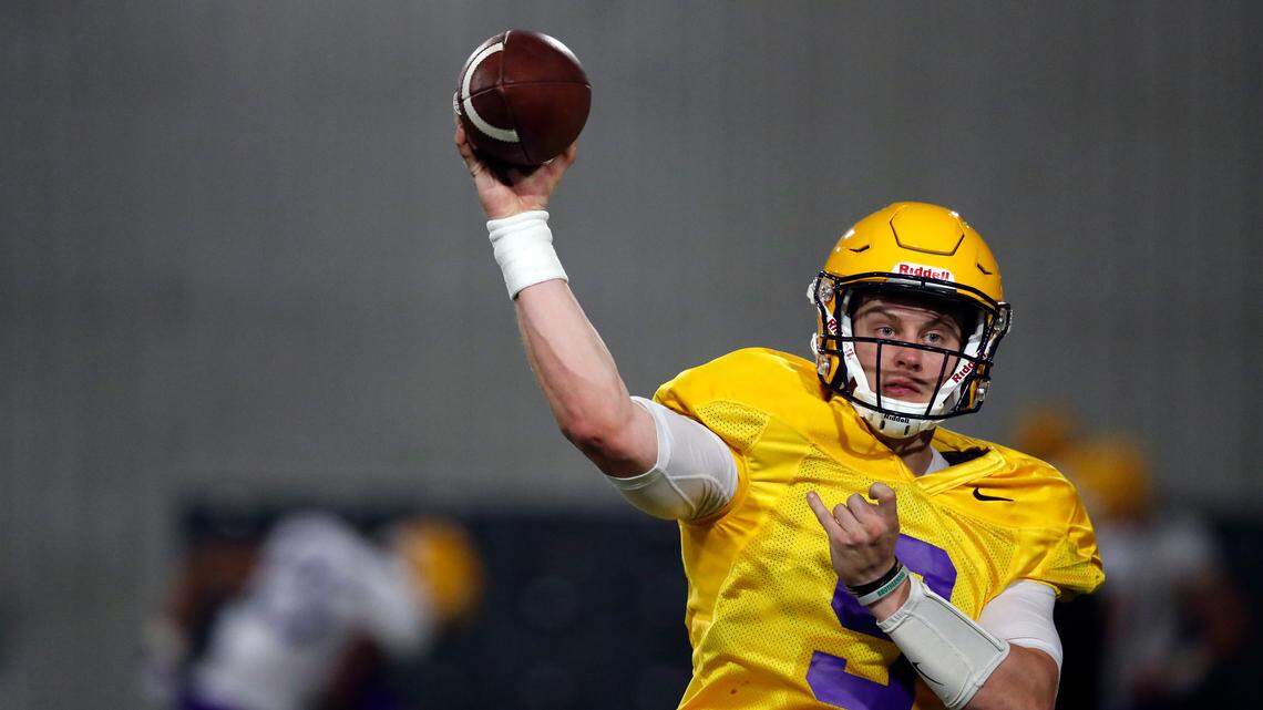 LSU quarterback Joe Burrow (9) passes during their NCAA college football practice in Baton Rouge, La., Monday, Aug. 6, 2018.