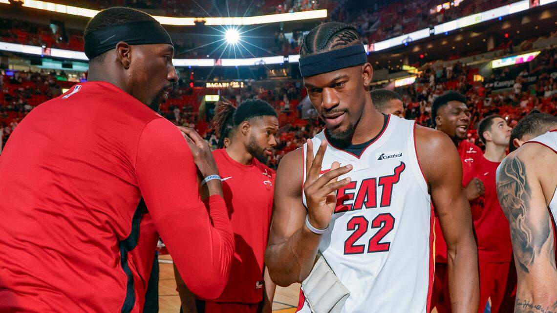 Miami Heat center Bam Adebayo (13) and forward Jimmy Butler (22) meet up on the court before the start of the game against the Toronto Raptors at the Kaseya Center, Miami, Florida on Sunday, April 14, 2024.