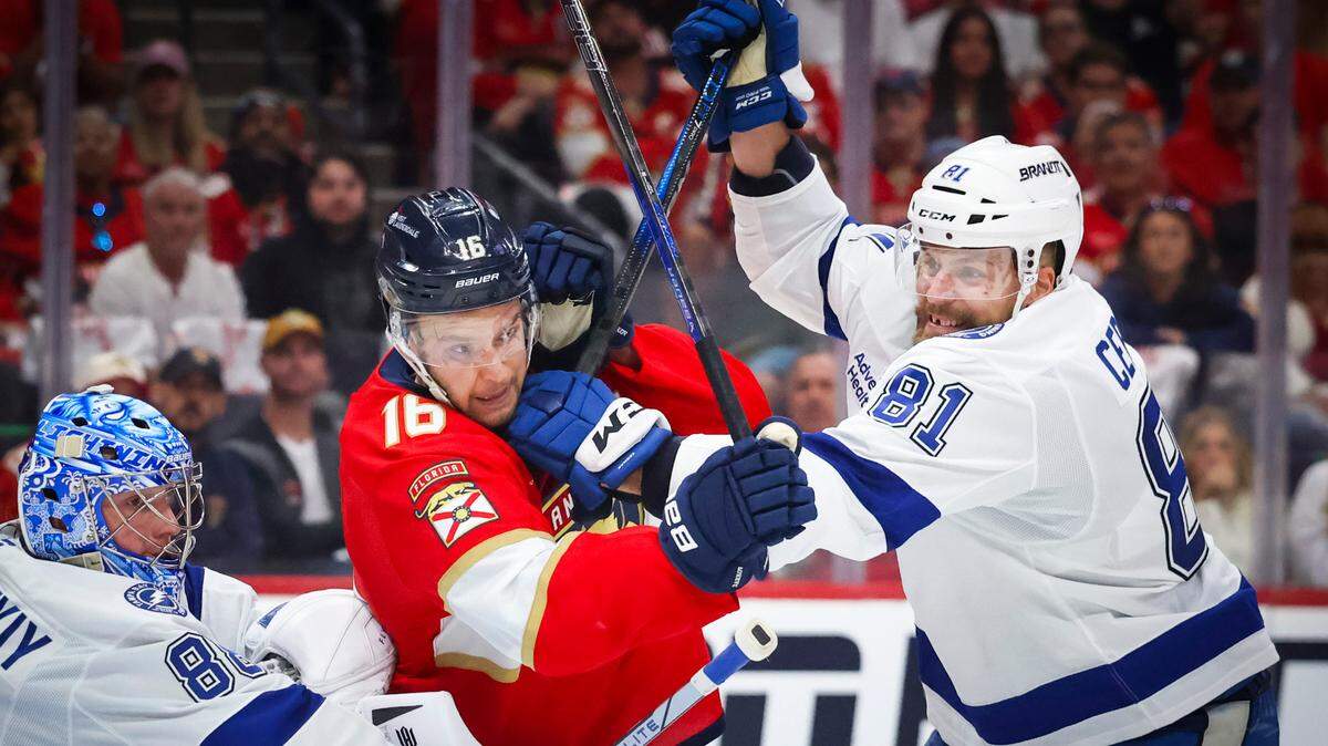 Florida Panthers center Aleksander Barkov (16) gets hit by Tampa Bay Lightning defenseman Erik Cernak (81) and goaltender Andrei Vasilevskiy (88) during the third period of Game 3 of the first-round Stanley Cup playoff series on Saturday, April 26, 2025, at Amerant Bank Arena in Sunrise, Fla. The Tampa Bay Lightning won.
