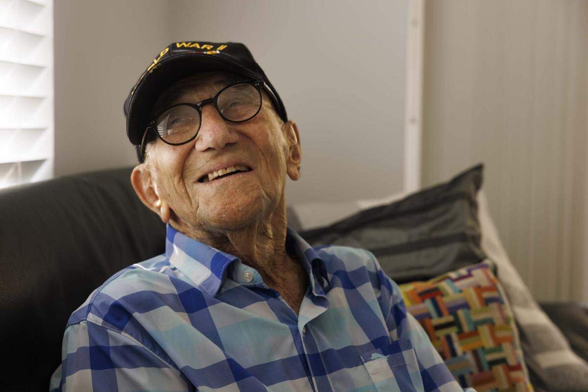 Hal Silberman, who is turning 101 on May 1st, smiles in his apartment on Thursday, April 30, 2026, at the Palace retirement community in Coral Gables, Fla. Silberman is one of the oldest WWII veterans in South Florida. He stays active in his retirement community, plays chess, and because he is a former doctor, gives lectures.
