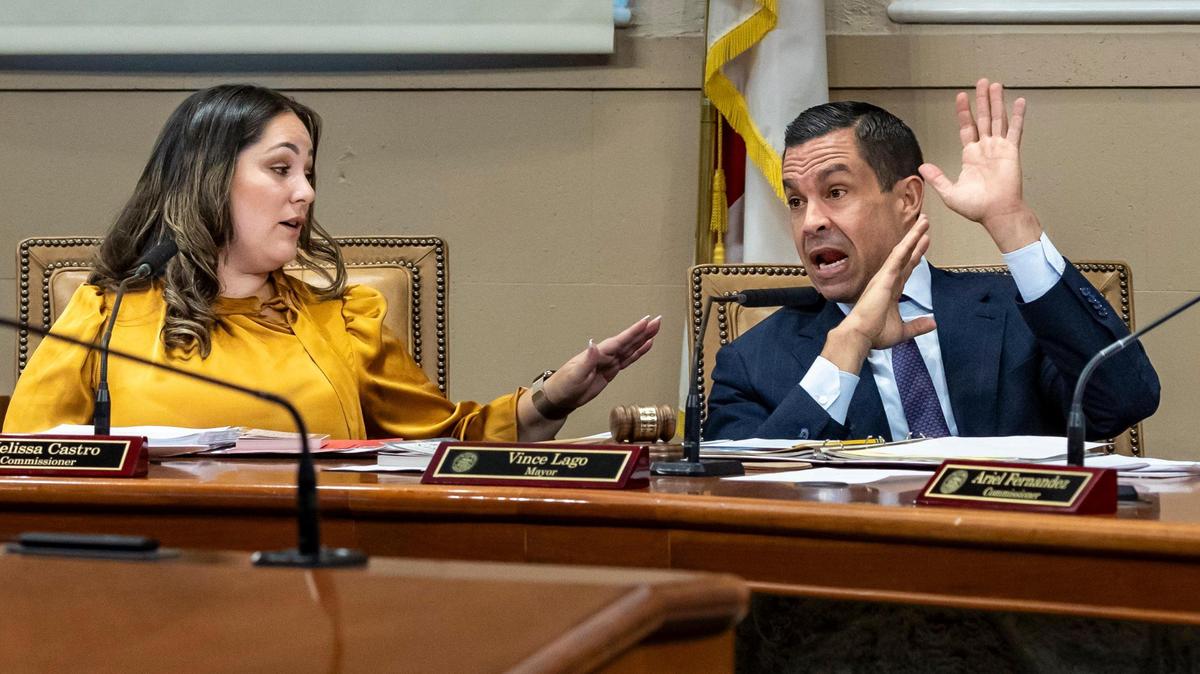 Coral Gables Mayor Vince Lago, right, gestures as he makes a point during a discussion with Commissioner Melissa Castro, left, during a Coral Gables City Commission meeting. The commission voted not to change election dates from April (odd years) to November (even years) by a 3-2 count.