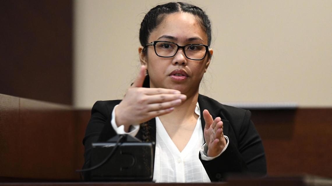 Katherine Magbanua, charged in the 2014 murder of Florida State law professor Dan Markel, mimics with her hands an incident involving Sigfredo Garcia cutting off her and Charlie Adelson with his car.