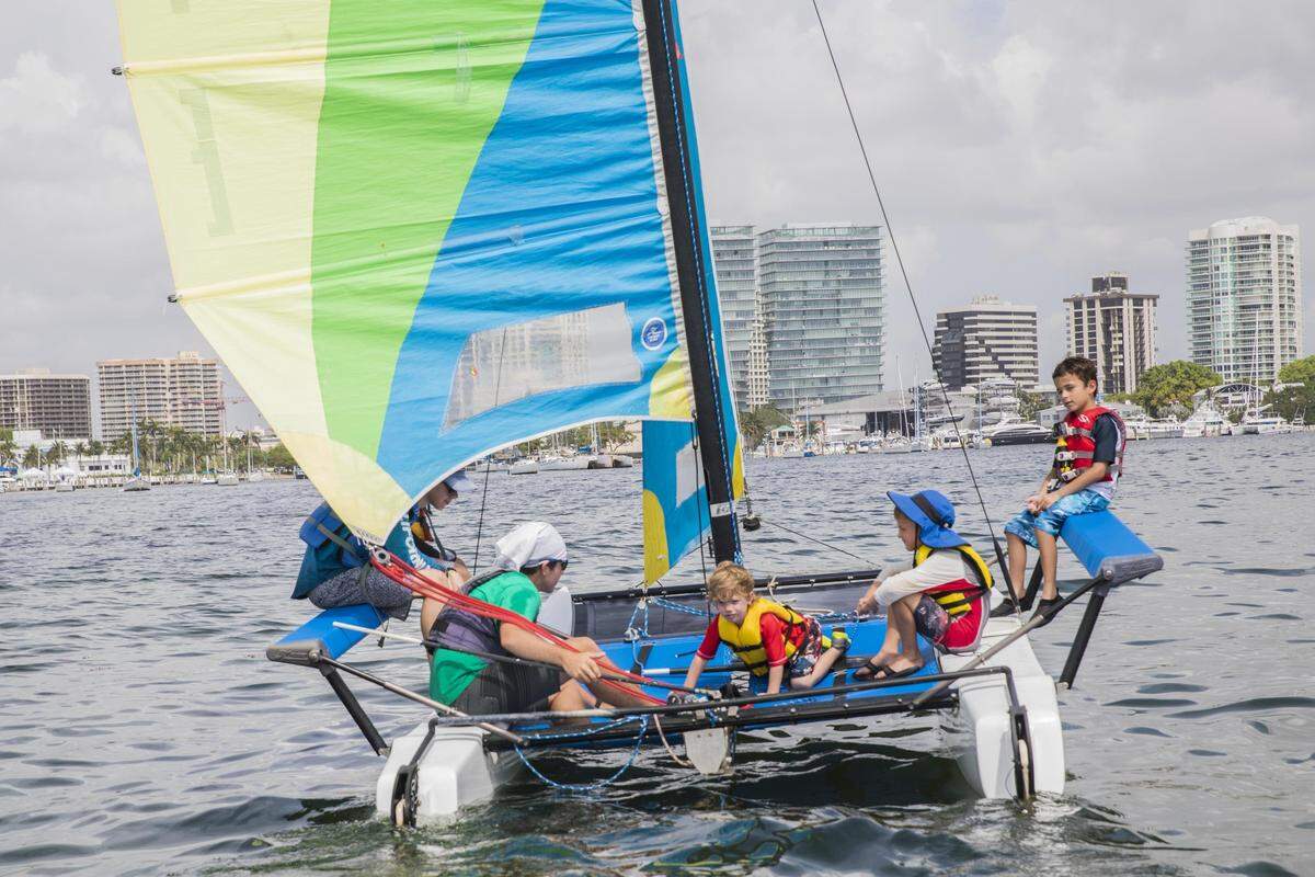 Campers from Shake-A-Leg Miami, an organization that works with children and adults with physical, developmental, and economic challenges, sail in Biscayne Bay on Friday, June 15, 2018.