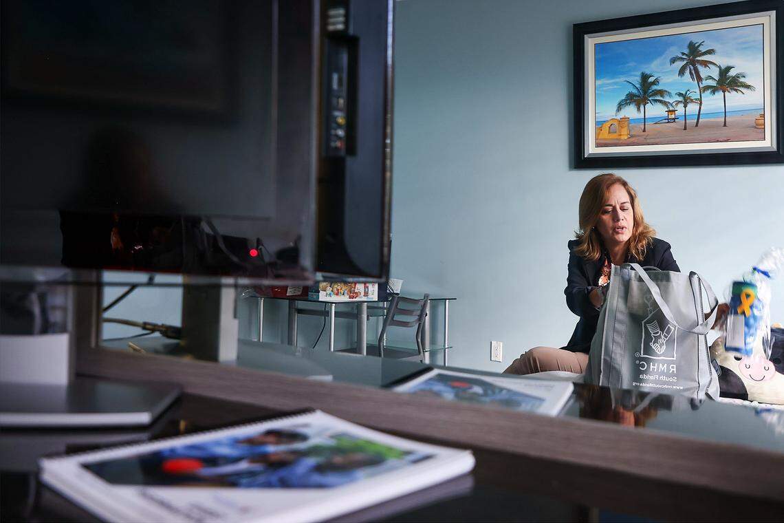 Ronald McDonald House Executive Director Soraya Rivera-Moya, shares the contents of the welcome bags that are left for families inside each room, on Wednesday, Feb. 18, 2026, in Miami.