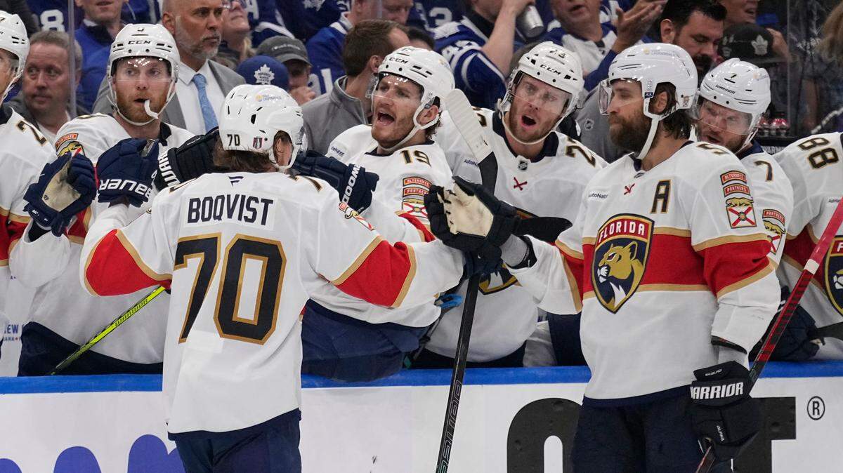 May 14, 2025; Toronto, Ontario, CAN; Florida Panthers defenseman Aaron Ekblad (5) congratulates Florida Panthers forward Jesper Boqvist (70) after his goal against the Toronto Maple Leafs during the second period of game five of the second round of the 2025 Stanley Cup Playoffs at Scotiabank Arena.