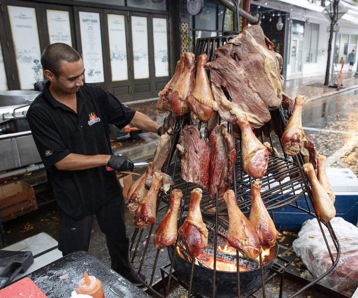 Cook Luise Mora of Will's Grill takes care of business during Calle Ocho festival on Sunday, March 15, 2026 in Little Havana. Andrew Uloza / for Miami Herald