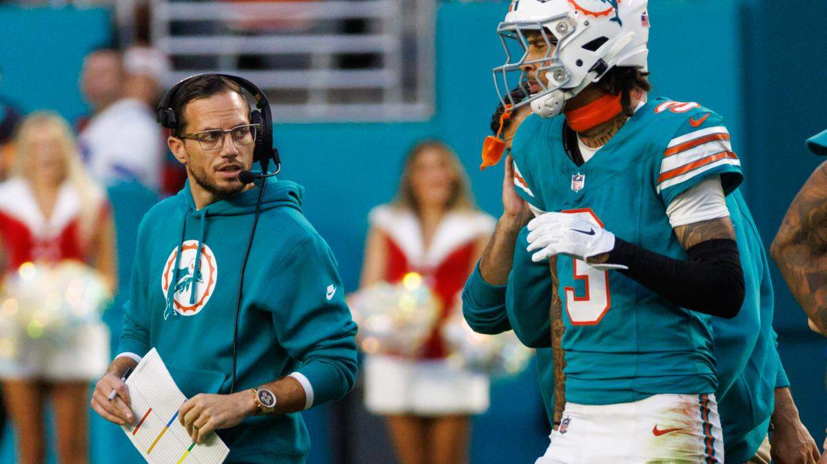 Miami Dolphins head coach Mike McDaniel talks with Dolphins wide receiver Robbie Chosen (3) after an injury during first quarter of an NFL football game against the Dallas Cowboys at Hard Rock Stadium on Sunday, Dec. 24, 2023 in Miami Gardens, Fl.