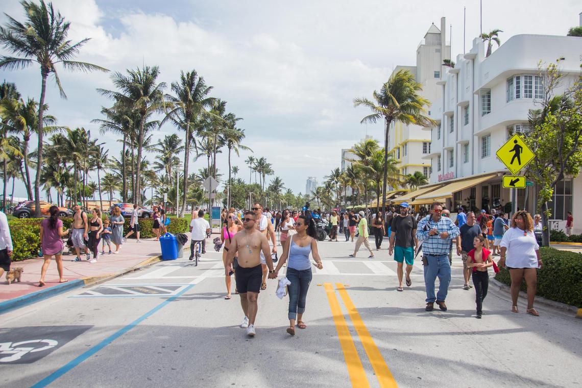 Hundreds of people walk up and down Ocean Drive in Miami Beach during Memorial day weekend on Sunday May 27, 2018.