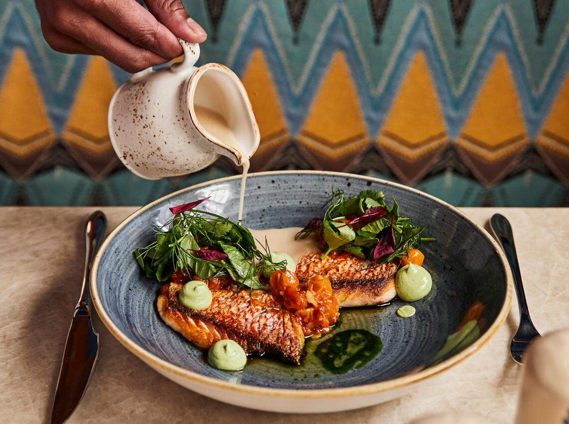 Grilled yellowtail snapper with charreed gooseberry salsa at Red Rooster Overtown